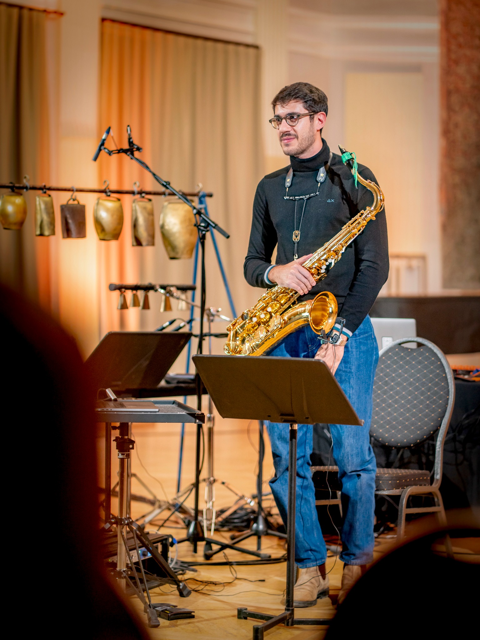 Alberto Michele Cavallaro standing on stage with his saxophone at Sound Plasma in Tallinn in 2024.